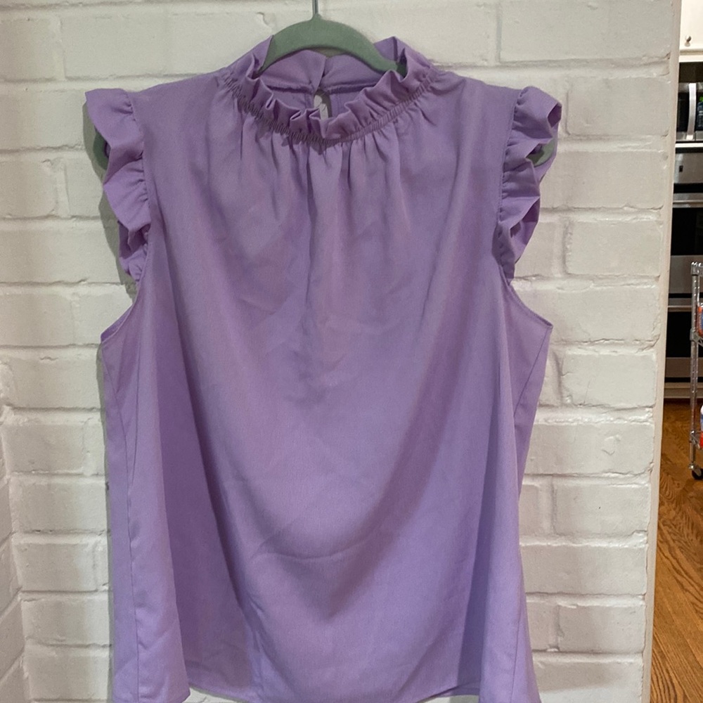 Lavender ruffled top from local boutique. Worn once.